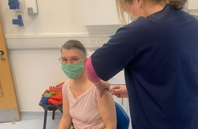 Rachel receiving her COVID vaccination.