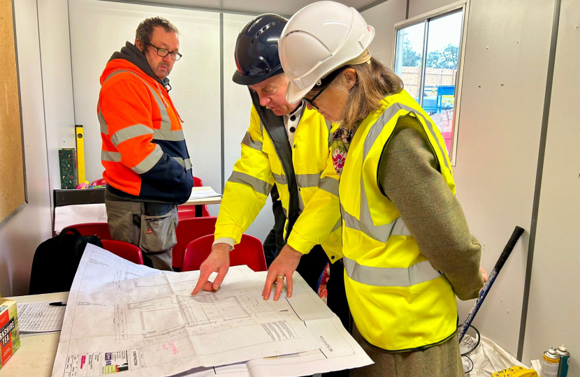 Rachel with Mick Fitzgerald viewing the plans for the youth and community centre.